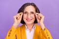 Photo of friendly professor white old lady wear eyewear yellow jacket isolated on purple color background