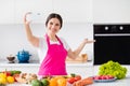 Photo of friendly sweet mature woman dressed pink apron smiling recording video modern device cooking lunch indoors