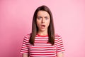 Photo of frightened pretty young brown hair lady wear stripy red white t-shirt isolated on pastel pink color background
