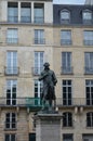 Front view to Le Marquis de Condorcet statue at Quai de Conti in Paris