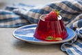 Photo of fruit jelly with fresh strawberry. Healthy food. Strawberry jelly on white plate. Summer dessert with fruit Royalty Free Stock Photo