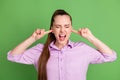 Photo of frustrated anger girl cant listen loud music noise close cover index finger scream wear lilac shirt isolated