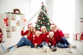 Photo of full big family five people gathering three little kids parents hold paper roof play hug smile wear x-mas Royalty Free Stock Photo