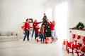 Photo of full big family five people meeting three little kids decorate x-mas tree dad help bring basket baubles garland Royalty Free Stock Photo