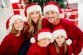 Photo of full big happy family five people meeting three little kids toothy beaming smiling wear x-mas headwear red Royalty Free Stock Photo