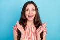 Photo of funky amazed lady raise palms open mouth wow sale reaction wear striped blouse isolated blue color background