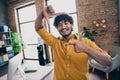 Photo of funky cheerful good mood man dressed trendy clothes having photographing you modern office Royalty Free Stock Photo