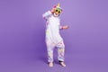 Photo of funky cool retired man nightwear overall dark pineapple eyewear smiling dancing isolated purple color