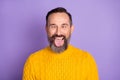 Photo of funky foolish crazy man crossed eyes tongue out mouth wear yellow pullover isolated violet background Royalty Free Stock Photo