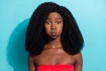 Photo of funky funny young dark skin woman hold breath cheeks grimace isolated on pastel blue color background