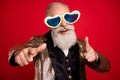 Photo of funky grey beard aged comic man point you wear eyewear gold suit isolated on red color background Royalty Free Stock Photo