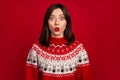 Photo of funky impressed girl dressed x-mas ornament pullover lips pouted plump big eyes isolated red color background Royalty Free Stock Photo