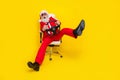 Photo of funky impressed retired guy wear red tux claus hat automobile driver rider isolated yellow color background Royalty Free Stock Photo