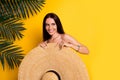 Photo of funky pretty lady wear bikini close body big sun hat looking empty space isolated yellow color background