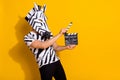 Photo of funky weird guy dressed wild animal costume holding clapper board empty space isolated yellow color background