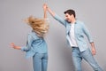 Photo of funny affectionate carefree couple dance guy spin girl wear casual jeans outfit isolated grey color background