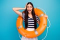 Photo of funny amazed lady crazy tourist long hair hold orange emergency life buoy hand on head open mouth wear white