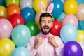 Photo of funny cool guy colorful decorations easter party festive party mood wear pink shirt bow tie suspenders fluffy