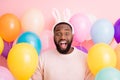 Photo of funny dark skin guy colorful decorations easter party festive mood open mouth wear sweater fluffy bunny ears on