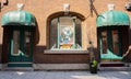 Photo of funny dog in the window of the store in old city of Quebec