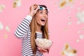 Photo of funny excited woman wear striped outfit 3d eyewear watching movie eating pop corn isolated pink color Royalty Free Stock Photo