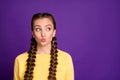 Photo of funny expression lady with long braids hairdo sending air kisses looking cunning empty space wear casual yellow