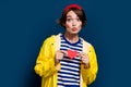 Photo of funny flirt coquette young woman send air kiss plump lips holding small gift cute postcard heart isolated on Royalty Free Stock Photo