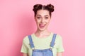 Photo of funny flirty girl stick-out tongue lick teeth wear jeans overall green t-shirt isolated on pink background