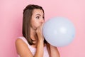 Photo of funny funky positive happy young woman blow air balloon celebrate holiday isolated on pink color background