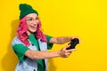 Photo of funny impressed eccentric girl pink hairdo dressed denim waistcoat hold play station joystick isolated on Royalty Free Stock Photo