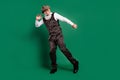 Photo of funny inspired senior man enjoy pub party dance wear cap striped suit scarf on green color background