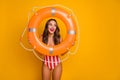 Photo of funny pretty lady slim sexy figure seashore look through orange life buoy interested flirty eyes lifeguard wear Royalty Free Stock Photo