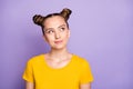 Photo of funny pretty lady youngster looking up empty space having crazy but smart idea wear yellow t-shirt isolated on