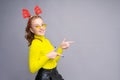 Photo of funny young woman in christmas deer costume wearing yellow glasses Royalty Free Stock Photo