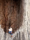 Close Up Photo, Gadget Addicted young Man, Holding Smartphone, sitting at hole of Door Wood