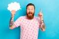 Photo of genius impressed man with redhair beard wear pink t-shirt hold mind cloud have brilliant idea isolated on blue