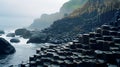 A photo of the Giant\'s Causeway, with hexagonal basalt columns as the background, during a misty morning Royalty Free Stock Photo