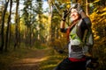 Photo of girl in helmet on bicycle in autumn forest