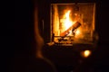 Photo of girl silhoette with glass near fireplace for graphic and web design, for website or mobile app.