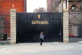 Girl walkiing by guinness factory gates