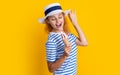 photo of glad summer girl with cone icecream in retro hat. summer girl with cone