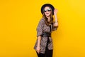 Photo of glamour happy charming lady look empty space wear sunglass isolated on yellow color background