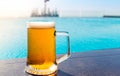 A glass of beer on a sunny day by the pool Royalty Free Stock Photo