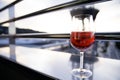 A glass of red wine on the balcony in the evening Royalty Free Stock Photo