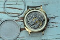 Photo of gold-plated wristwatch on the wood