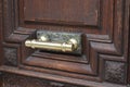 Gold and wooden door handle Royalty Free Stock Photo