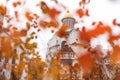 Golden dome of orthodox church surrounded by small orange leaves Royalty Free Stock Photo