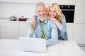 Photo of good mood beautiful smiling couple mature wife hug embrace husband surfing intent browsing computer laptop