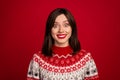 Photo of good mood funky girl dressed x-mas ornament pullover big eyes smiling isolated red color background Royalty Free Stock Photo