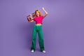 Photo of good mood positive woman wear trendy pink clothes listen music yes weekend chill isolated on purple color Royalty Free Stock Photo